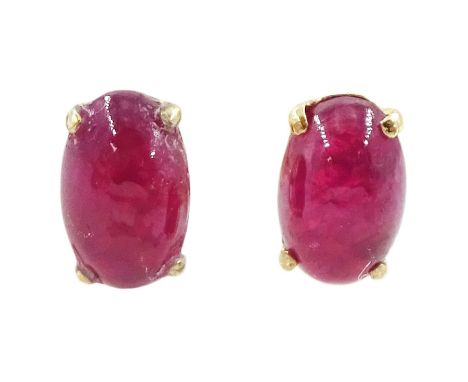 Pair of 9ct gold oval cut cabochon ruby stud earrings, stampedCondition Report:Approx 0.35gm, overall head = 4.8mm x 3.2mm, g