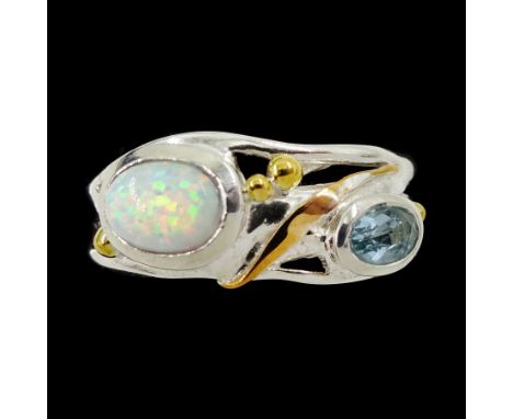 Silver and 14ct gold wire blue topaz and opal ringCondition Report:Size T, max depth = 8.1mm