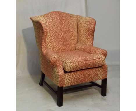 Georgian style wingback armchair upholstered in pink animal print fabric  