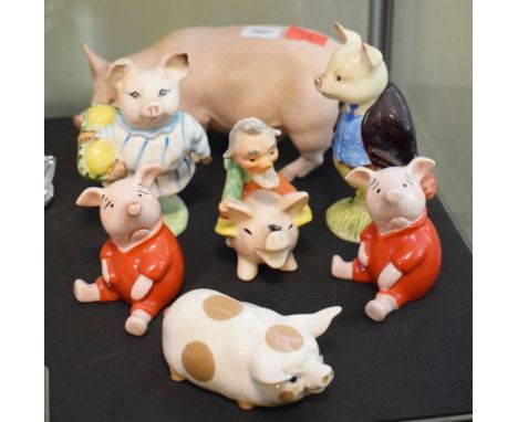 Group of seven assorted ceramic pigs to include Beswick, Beatrix Potter 'Little Pig Robinson' and 'Pigling Bland', pair of Be