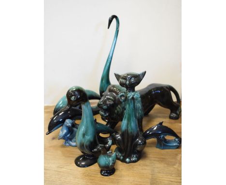Collection of Blue Mountain Canadian pottery animals, two graduated Poole pottery dolphins and an Otter  