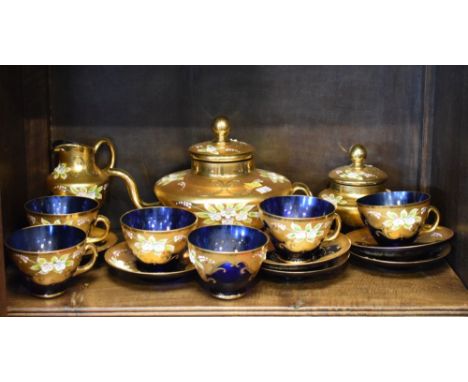 Bohemian blue glass tea service decorated with enamel flowers on a gilded ground  