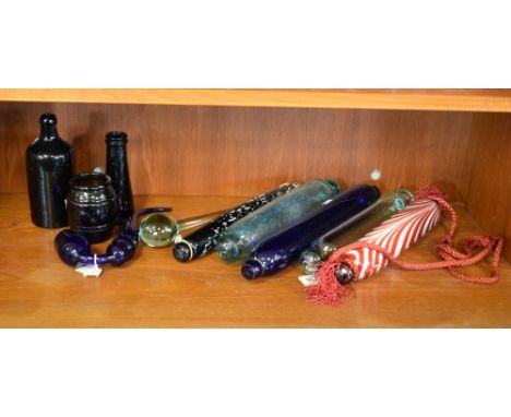 19th Century green moulded blown glass bottle, blue glass novelty pipe, glass drum stick and five glass rolling pins  