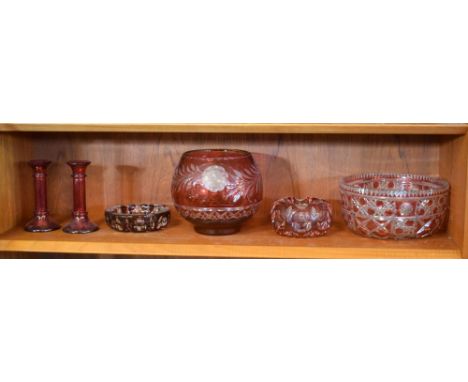 Collection of ruby cased cut glass bowls, together with a pair of red glass candle sticks  