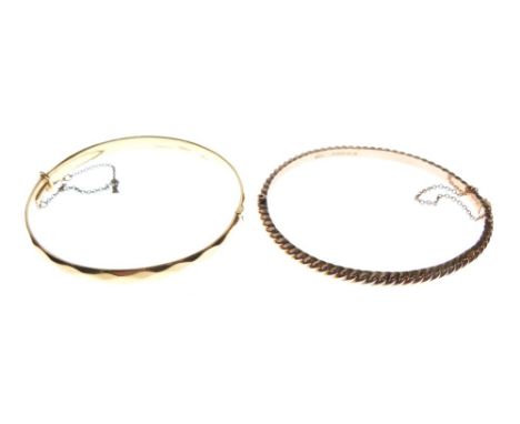9ct gold snap bangle of rope-twist design, together with a second yellow metal bangle of faceted design stamped '9ct Metal Co