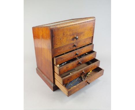 A collection of horological tools to a cabinet and wood case, together with a group of related books and catalogues.