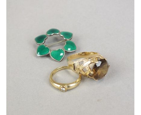 A 9ct gold single stone diamond ring, together with a 9ct gold smoky quartz dress ring and a green enamel Sterling silver Dan