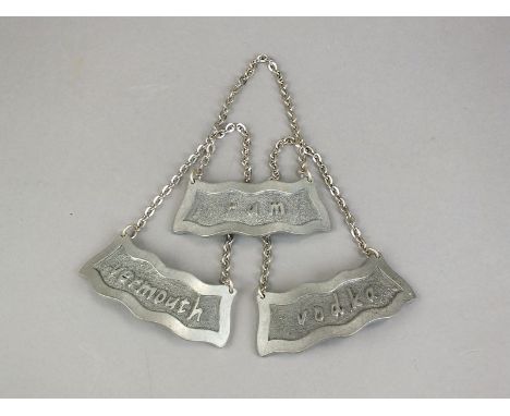 Three Jorgen Jensen pewter decanter labels, 'Vodka', 'Rum' and 'Vermouth', each stamped to the reverse 'Jorgen Jensen Dennmar