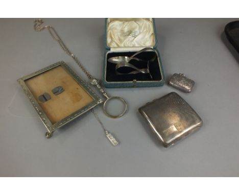 A cased silver spoon and pusher, together with a silver vesta case, a silver cigarette case and a collection of silver and pl