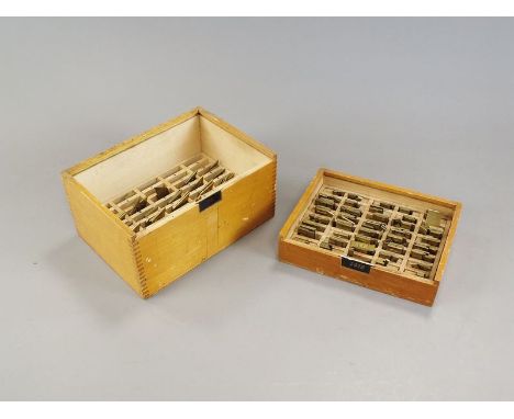 Box containing four various light wood boxes containing brass letters and numbers for printing and various associated accesso