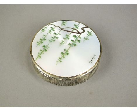 A silver and enamel compact, with import mark for London 1925, the circular engine turned box with enamel cover depicting wis