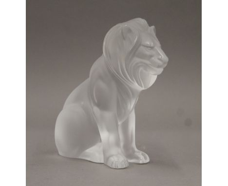 A Lalique model of a lion, marked Lalique, France. 20 cm high.