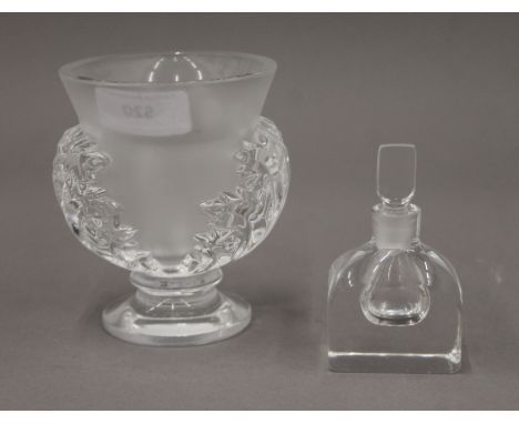 A Lalique glass vase, script mark Lalique France and an Orrefors glass scent bottle with stopper, signed. The former 12 cm hi