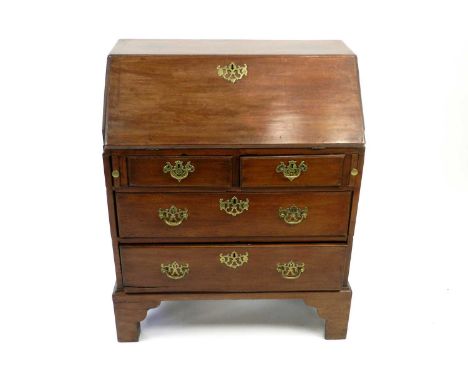 A George III mahogany bureau, the fall front above two short and two long drawers, raised on bracket feet, 66cm wide, 94cm hi