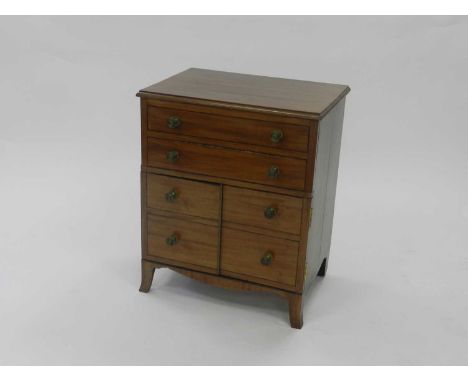 A George III style mahogany cabinet, converted from a 19th century commode, the moulded top above a false front with faux dra