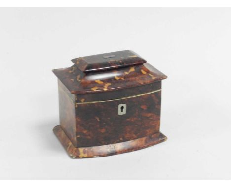 A 19th century tortoiseshell tea caddy, of casket form, the hinged cover opening to a single compartment with internal lid, 1