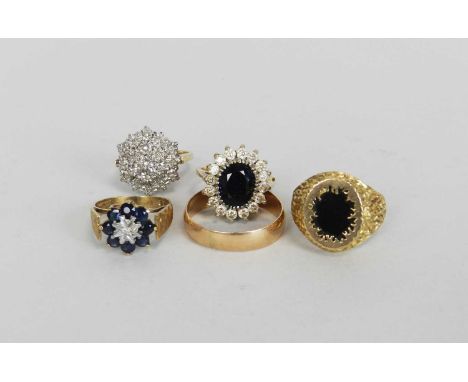 A 9ct gold diamond cluster ring, together with a 9ct gold sapphire ring, a yellow metal band, a 9ct gold onyx ring and a cubi