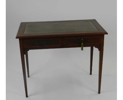 An assembled group of Edwardian mahogany furniture, including a cross-banded writing table with green leather skiver and two 