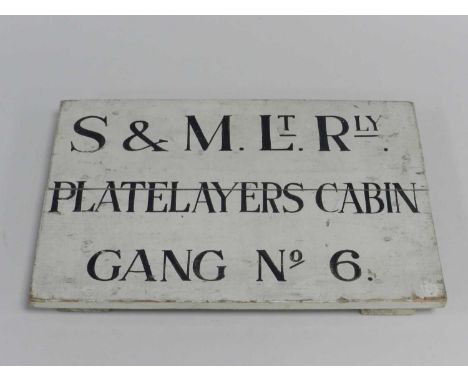 A Shropshire &amp; Montgomeryshire Light Railway railside sign, painted wood, inscribed 'S&amp;M.Lt.Rly. / PLATELAYERS CABIN 
