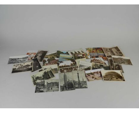 A collection of loose postcards, mostly early 20th century, including topographical and portrait subjects with some embroider