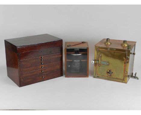 An early/mid 20th century mahogany-cased dental surgery kit, including various implements and bottles to six drawers, togethe