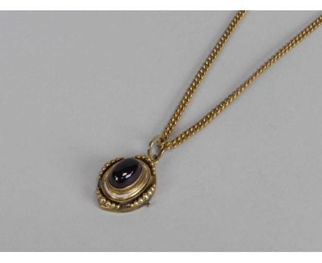 A 19th century garnet pendant, designed as an oval cabochon garnet within white enamel border and graduated bead surround, no