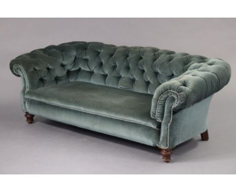 A Chesterfield sofa, upholstered light blue velour, on short turned legs, 70” wide x 25” high x 33” deep.