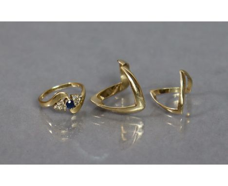 Two 9ct. gold “wishbone” rings (4.5 gm combined); &amp; a 14K ring set small sapphire with trios of small diamonds either sid