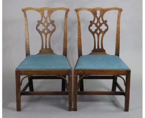 A pair of Chippendale-style mahogany dining chairs with pierced splat backs &amp; padded drop-in seats, on square chamfered l