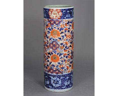 A late 19th/early 20th century Japanese Imari cylindrical stick stand with typical floral decoration, 24” high.