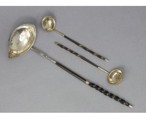 A George III silver punch ladle with reeded rim to the oval bowl, whalebone twist handle, 13½” long, London 1971 (maker’s mar