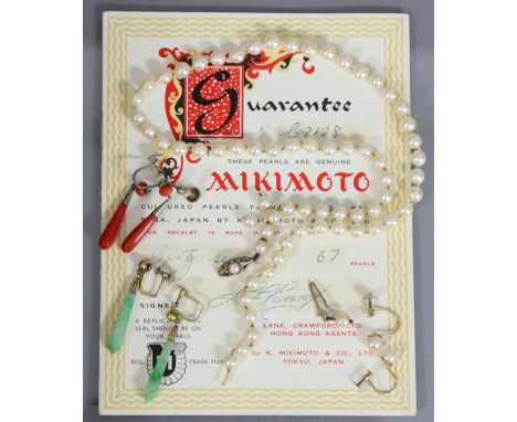 A single row necklace of sixty-seven Mikimoto cultured pearls of uniform size, purchased 1957 from Lane Crawford, Hong Kong, 