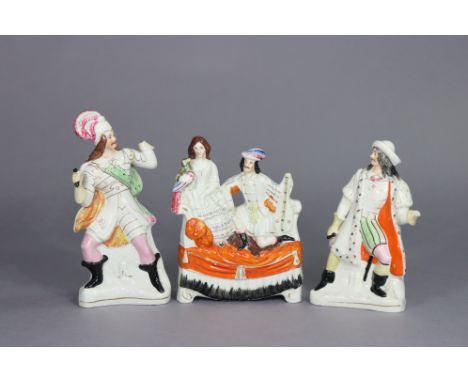 A Victorian Staffordshire pottery flat-back group of male &amp; female figures seated on a sofa, 10” high x 7½” wide; &amp; t