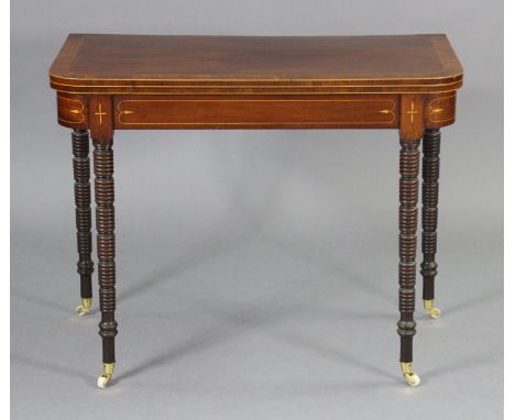 A 19th century inlaid mahogany card table inset green baize to the rectangular fold-over top, on ring-turned legs with later 