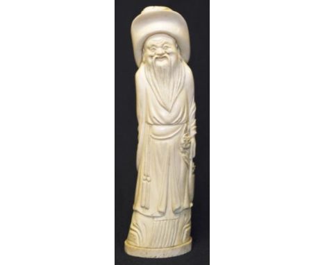 Antique Chinese ivory figure of a man with large flowing hat. Late qing period. 23cm high.NB This item may not be exported.