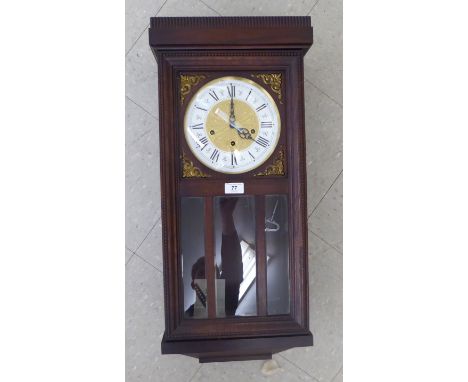 A mid 20thC oak cased wall clock; the Westminster chime movement faced by a silvered Roman dial  29''h       HSR