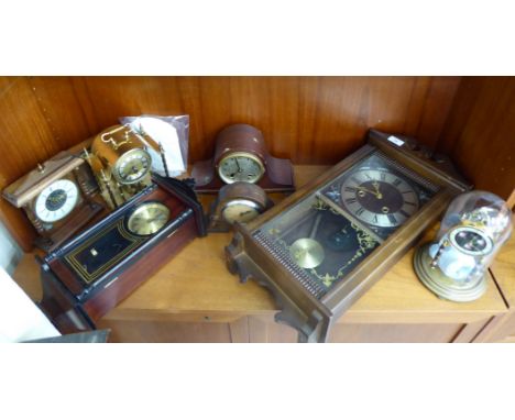 Clocks: to include a mid 20thC lacquered brass Anniversary clock, under a glass dome  10''h       SR