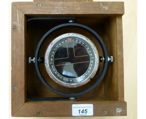 A gimbal mounted ship's compass, in a mahogany case  8.5''sq       CS