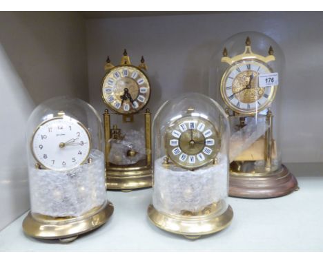 Clocks: to include a lacquered brass Anniversary clock, under a glass dome  12''h      RAB
