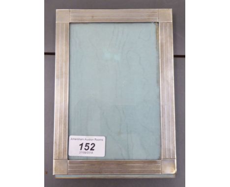 A Tiffany & Co silver photograph frame with engine turned decoration  stamped Sterling  4'' x 6''       CS