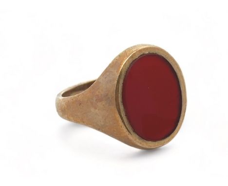 A 9ct gold Carnelian signet ring, size R. Marks for London 1965. Carnelian approx 15mm x 11mm. Weight 5.35g. Please see the b