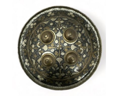 Indian/Persian brass and gilt enamel circular dhal shield, typically domed and centred by four bosses, decorated with dense s