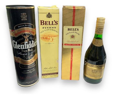 Four bottles of Alcohol. Three bottles of Whiskey, of which two bottles are Bell's finest old scotch whiskey with boxes, one 