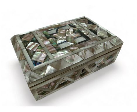 An inlaid mother of pearl hinged jewellery / trinket box on four feet, possibly Victorian. Dimensions approx 10cm x 15cm. Box