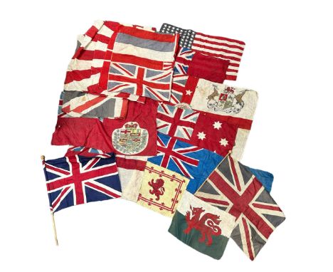 A range of 14 vintage Flags and Banners. Including Red Ensign, US, British Empire, Wales, Boer War and others. In used condit