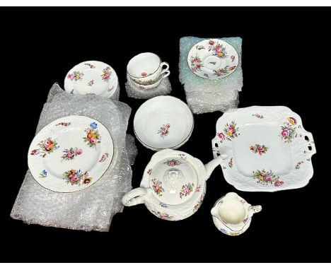 Coalport floral pattern teaset, circa 1900, comprising a teapot, sugar bowl, milk jug, finger bowl, serving plate, 12 cups an