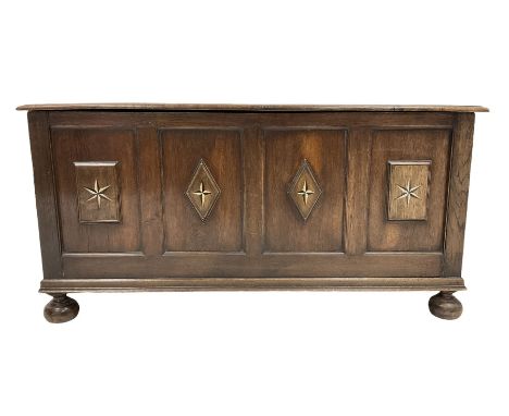 19th century oak coffer or blanket chest, the hinged moulded lid over quadruple panelled front, mounted by moulded lozenge an