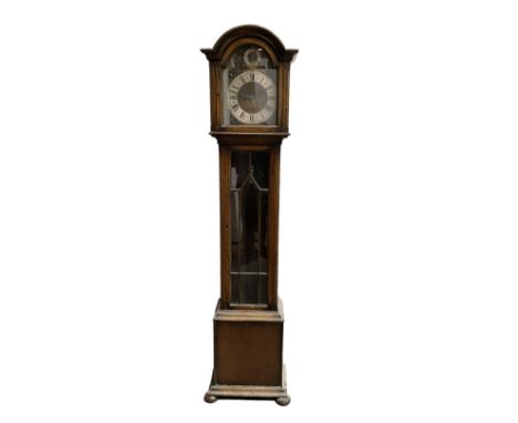 English - 20th century oak cased 8-day chiming granddaughter clock with a break arch pediment, fully glazed trunk door on a r