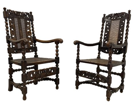 Late 19th century Carolean style oak open armchair, the cresting rail carved with pierced crown and scrolled foliage, cane wo