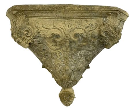 Composite stone wall pocket or planter, decorated with rams head and foliate decorationDimensions: Height:&nbsp;39cm&nbsp; Le